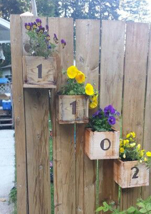 Cedar fence-post planters with house numbers