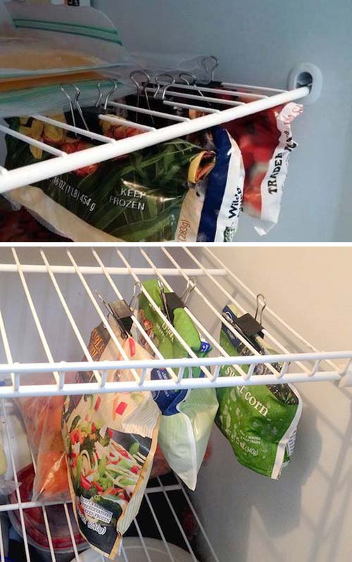 binder clips hanging from freezer shelves