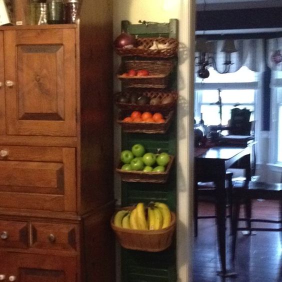 woven baskets on the old shutter to get hanging pantry storage