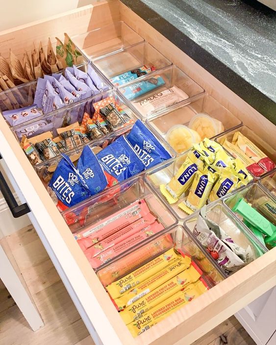 Snack cabinet all set up, with the toddler's snacks within their reach  (bottom shelf not pictured is surplus) : r/organization