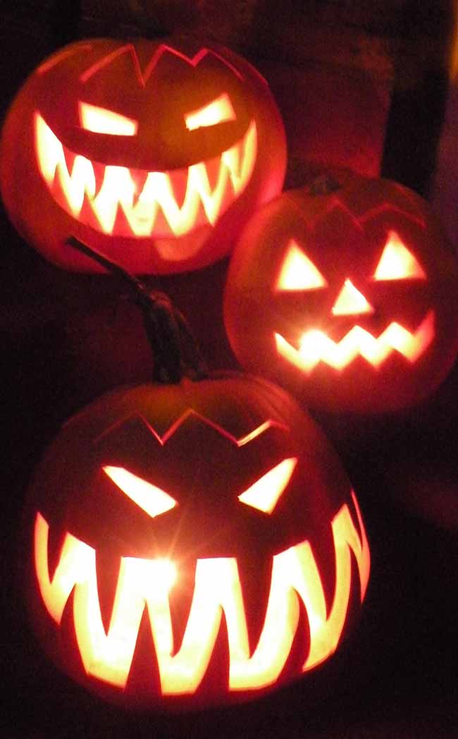 With their sharp, jagged teeth and angry eyes, these pumpkins glow with a spooky red light.