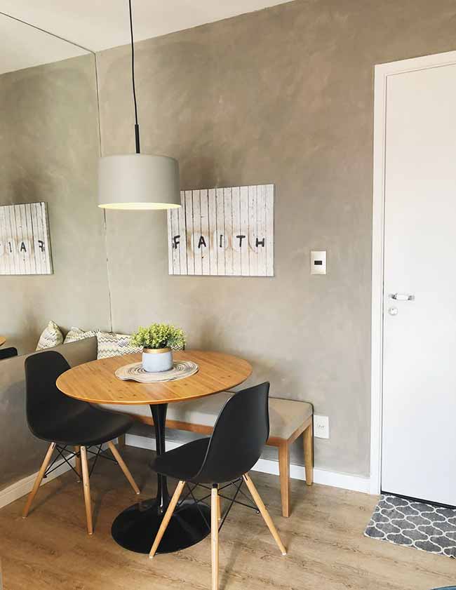 Mirrors are a small room’s best friend. Hang one behind your table and it instantly makes the corner brighter, bigger, and more welcoming. Add a round pedestal table and you save floor space too. It’s a simple upgrade with a big payoff.