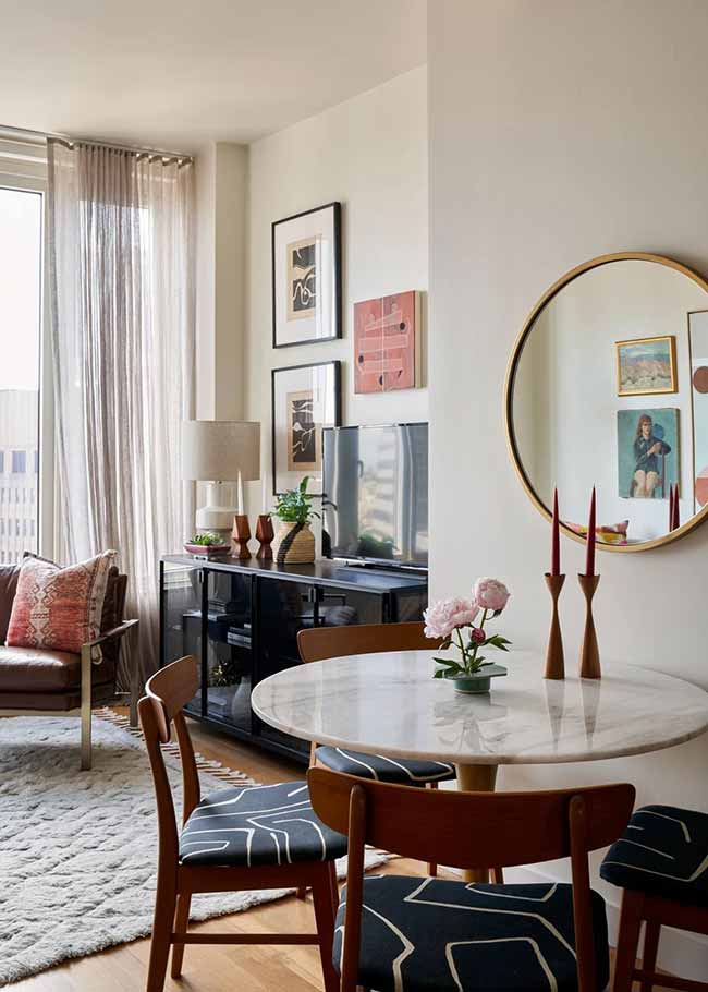Corners often get wasted, but a round table turns one into a cozy dining nook. No sharp edges, no bulky footprint—just an easy, conversational spot that feels natural. Add a mirror on the wall to echo the shape and make it feel intentional.