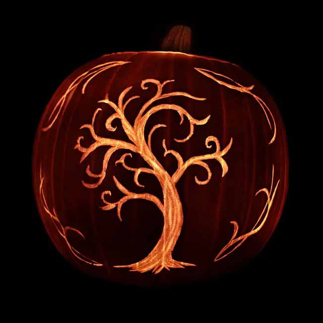 Proving that pumpkin carving can be truly elegant, this one features a beautifully etched design of a swirling tree.