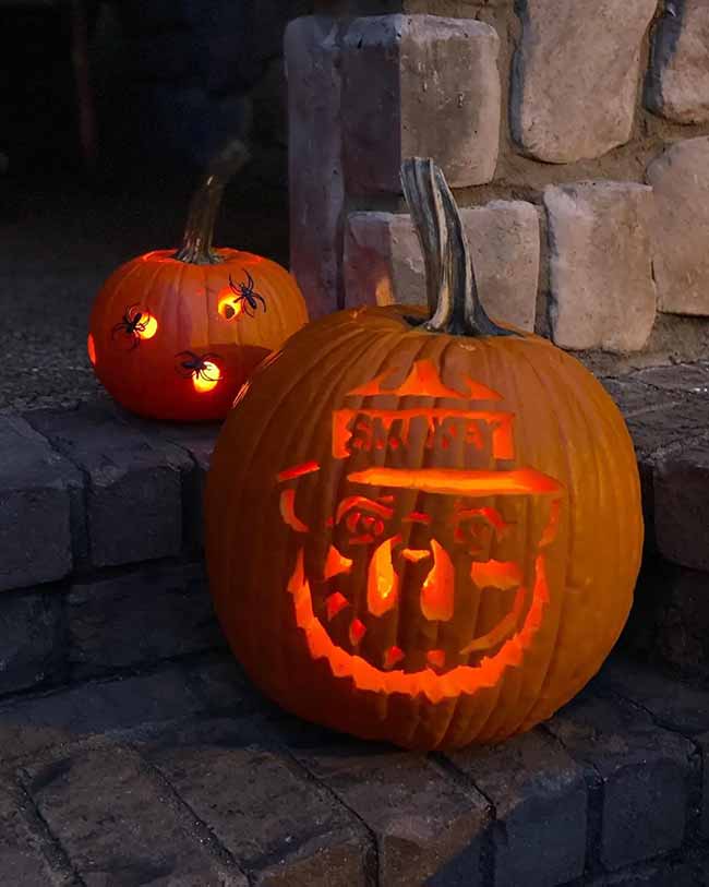 Even Smokey Bear is getting into the Halloween spirit with this unique jack-o'-lantern design. His friend in the background is covered in spooky spiders.