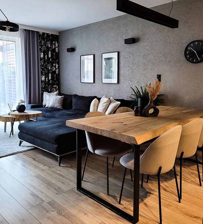 Match the look of your dining furniture to the rest of your living room and it all flows. Wood, metal, or neutral tones—whatever your style, carry it through so the table feels like part of the plan. A table behind the couch can save room while blending right in.