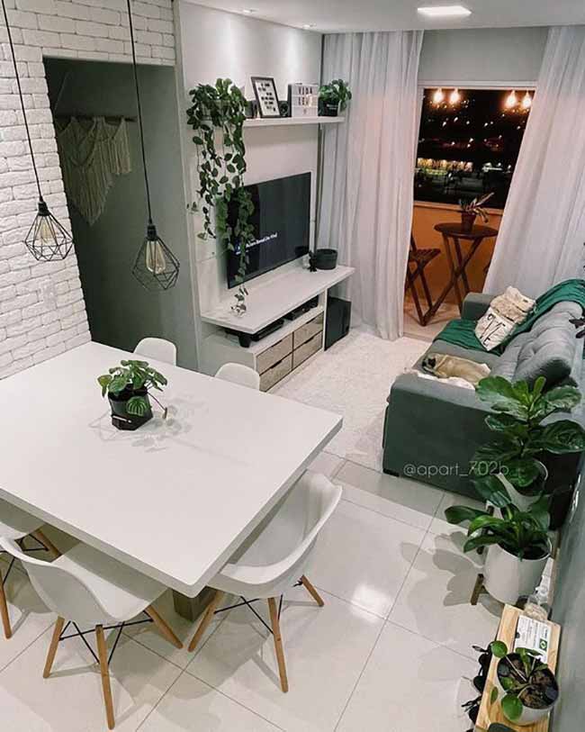 White on white can make a small room feel calm and airy. A table and chairs that blend into the walls almost disappear. The space looks bigger, lighter, and less cluttered. Pendant lights above are enough to highlight the dining zone without breaking the flow.