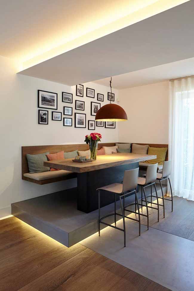 If you’re open to a little renovation, turn the dining area into something that feels special. A raised platform with built-in seating instantly sets it apart and makes it the star of the room. Add lighting underneath or overhead and you get that cozy, restaurant-like vibe right at home.