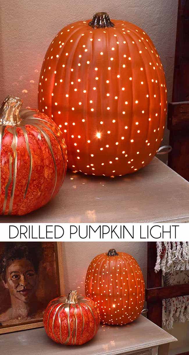 This pumpkin isn't carved with a face, but instead has dozens of tiny holes drilled into it to create a cool, starry light pattern.