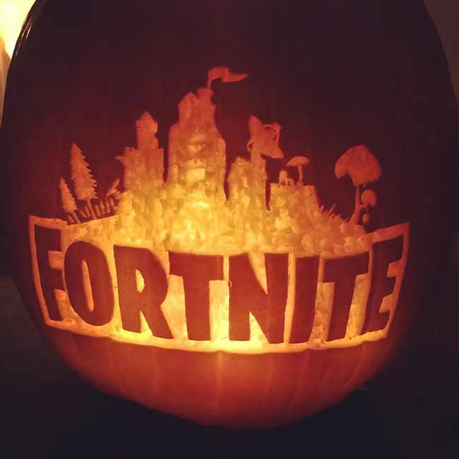 Gamers will love this pumpkin carving featuring the Fortnite logo. It also includes some buildings and trees from the game.