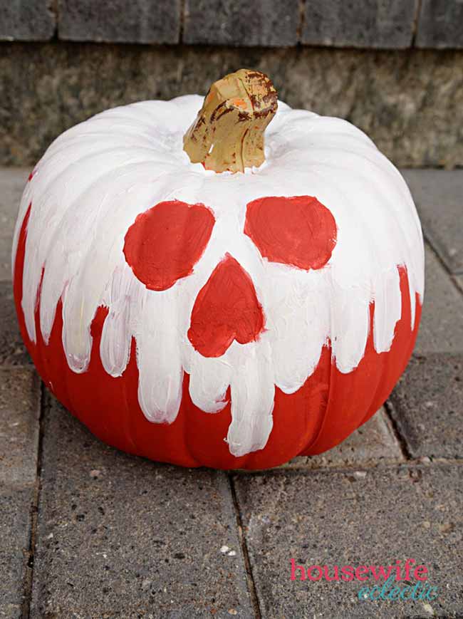 This pumpkin has a  red skull-and-crossbones on the front.